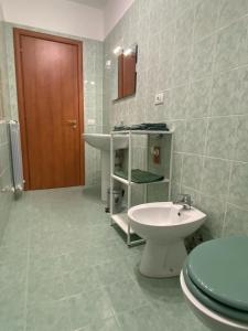 a bathroom with a sink and a toilet in it at Fontana Apartment 2 in Perugia +10 photos