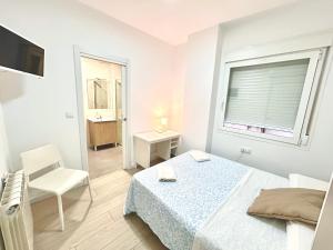 Łóżko lub łóżka w pokoju w obiekcie HOSPEDAJE LA PAZ