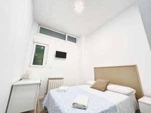 Łóżko lub łóżka w pokoju w obiekcie HOSPEDAJE LA PAZ