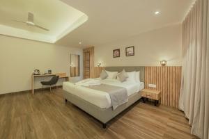 Hotel Shoolin Comforts客房内的一张或多张床位
