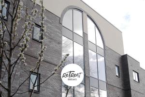 a building with a sign on the side of it at FREE GATED PARKING - 2 bed Apartment - Holbeck Leeds in Beeston Hill +3 photos