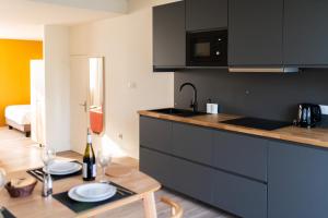a kitchen with a table with plates on it at Villa Aura in Eu