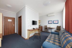 TV a/nebo společenská místnost v ubytování Hotel Nikolas