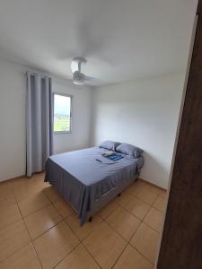 Ένα ή περισσότερα κρεβάτια σε δωμάτιο στο Apartamento em Condomínio