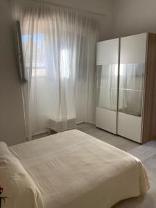 Postel nebo postele na pokoji v ubytování La Riccia Guest House
