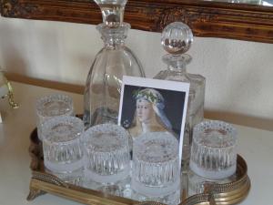 a picture of a woman in a glass bottle at Spa&Golf-Suite Velden in Velden am Wörthersee