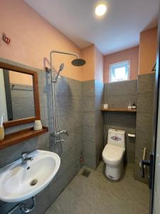 a bathroom with a sink and a toilet at Laholm Hotel - Apartment in Nha Trang +82 photos