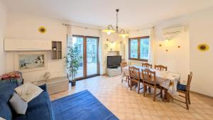a living room with a table and a couch at Villa Girasole Luxury Amalfi Coast in Minori