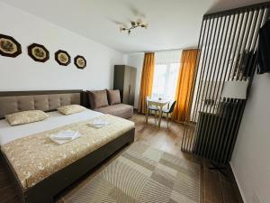 Ένα ή περισσότερα κρεβάτια σε δωμάτιο στο Serenity Apartments and Studios