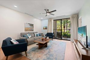 a living room with a couch and a tv at Condo with Pool Tennis Pickleball in Ocotal