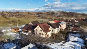 an aerial view of a house in the snow at Larisa in Cacica