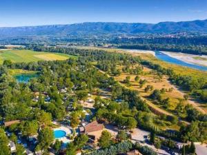 an aerial view of a resort with a river at Comme Chez Vous Au Camping Des Iscles in La Roque-dʼAnthéron