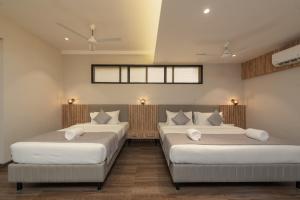 Hotel Shoolin Comforts客房内的一张或多张床位