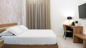 Postel nebo postele na pokoji v ubytování Hotel Diana