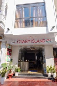 a building with a sign that reads chain island at Cat Ba Charm Island Hotel in Cat Ba