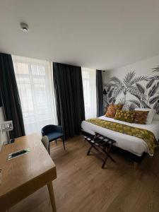 Postel nebo postele na pokoji v ubytování Hôtel Moderna