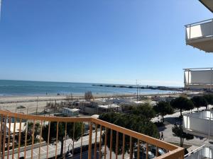 a view of the beach from the balcony of a condo at La Corte Dei Mari Acquamarina in Cesenatico