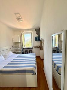 A bed or beds in a room at Belvedere Affittacamere