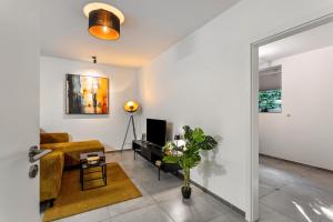 TV a/nebo společenská místnost v ubytování Tua Casa - Souterrain Appartment