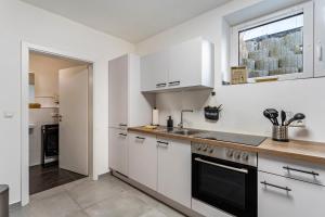 Kuchyň nebo kuchyňský kout v ubytování Tua Casa - Souterrain Appartment