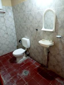 a bathroom with a toilet and a sink at Hostal del Cerro in Belén +35 photos