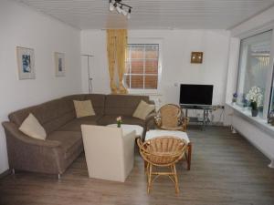 Μια τηλεόραση ή/και κέντρο ψυχαγωγίας στο Apartments Bensersiel