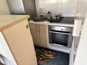 Kuchyň nebo kuchyňský kout v ubytování Dream Home