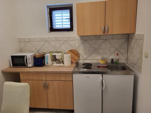 Kuchyň nebo kuchyňský kout v ubytování Rooms Mande