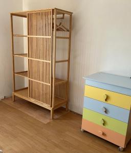 a dresser and a shelf next to a dresser at Casa la torre al 14 in Rome +3 photos