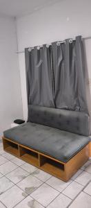 a bed sitting on top of a table at Cantinho do Forte in Praia Grande
