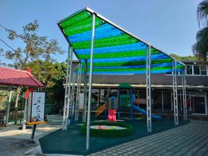 a playground in front of a building at Moon Villa in Zhongpu