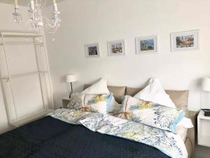 a room with a bed with pillows on it at Apartment mit Blick ins Grüne in Mitterfels