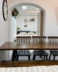a table and chairs in a room with a mirror at Moneystay Daegu Palgongsan in Daegu