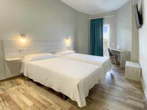 Postel nebo postele na pokoji v ubytování Te Maná Hotel