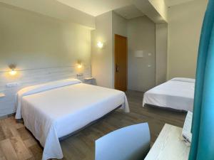 Postel nebo postele na pokoji v ubytování Te Maná Hotel