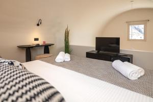 A television and/or entertainment centre at Depalyma Suites