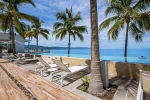 a resort with palm trees and a swimming pool at Harbor 171 TN 2110 in Puerto Vallarta