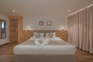 Hotel Shoolin Comforts客房内的一张或多张床位