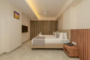 Hotel Shoolin Comforts客房内的一张或多张床位