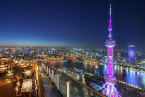 a view of the oriental pearl tower at night at The Ritz-Carlton Shanghai, Pudong in Shanghai