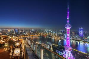 a view of the oriental pearl tower at night at The Ritz-Carlton Shanghai, Pudong in Shanghai