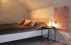 a bedroom with a bed with pillows on it at Prachtig appartement midden op Jachthaven Zeeland VP018 in Bruinisse