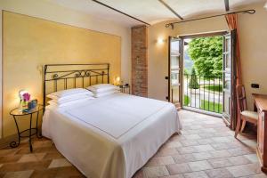 Postel nebo postele na pokoji v ubytování Relais Montemarino