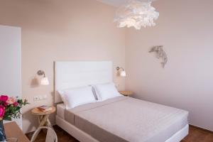 Posteľ alebo postele v izbe v ubytovaní Hermes Beach Front