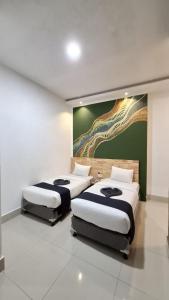 Voodi või voodid majutusasutuse D'Hills Hotel toas