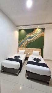 Voodi või voodid majutusasutuse D'Hills Hotel toas