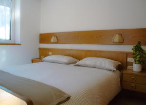 Postel nebo postele na pokoji v ubytování Locanda La Ruscoletta