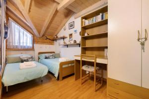 Postel nebo postele na pokoji v ubytování Fresia Chalet
