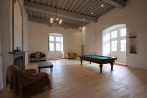 a large room with a pool table in it at Château de Fourcès in Fourcès