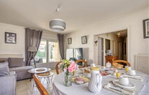 a kitchen and living room with a table and chairs at 3 Bedroom Gorgeous Home In Rochefort in Rochefort